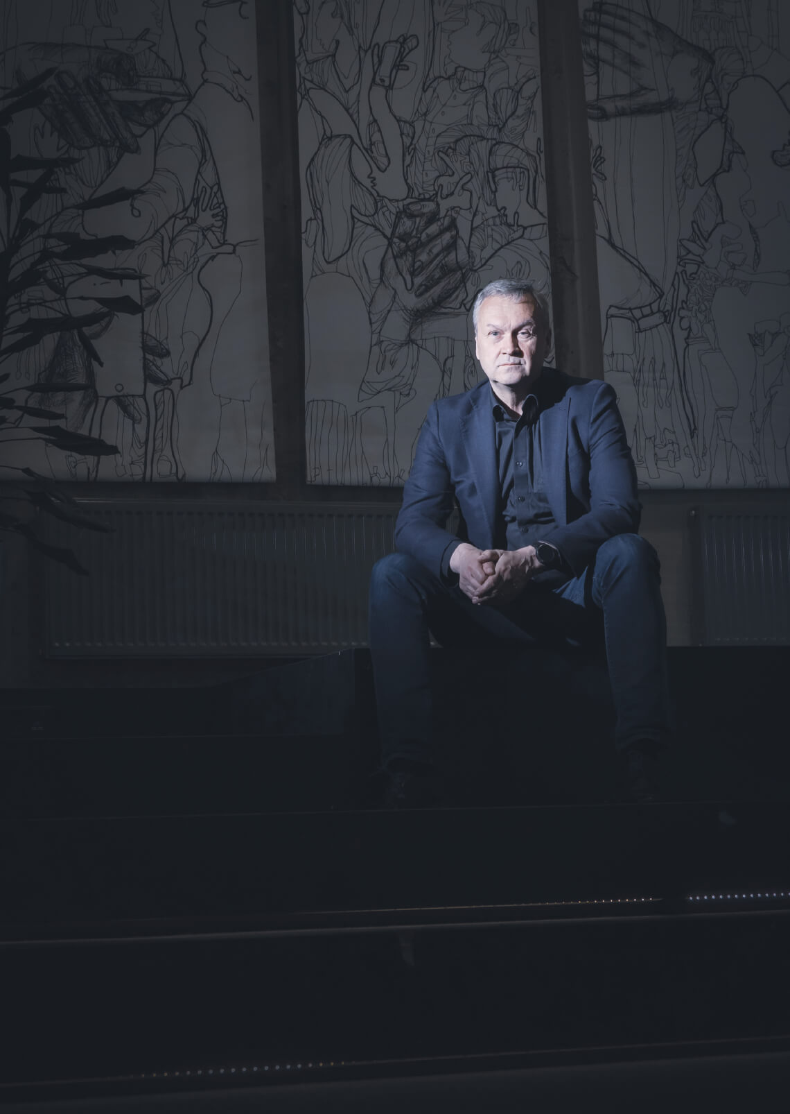 Jukka Laakso sitting high contrast far away